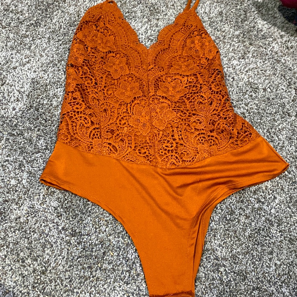 Burnt orange body suit
